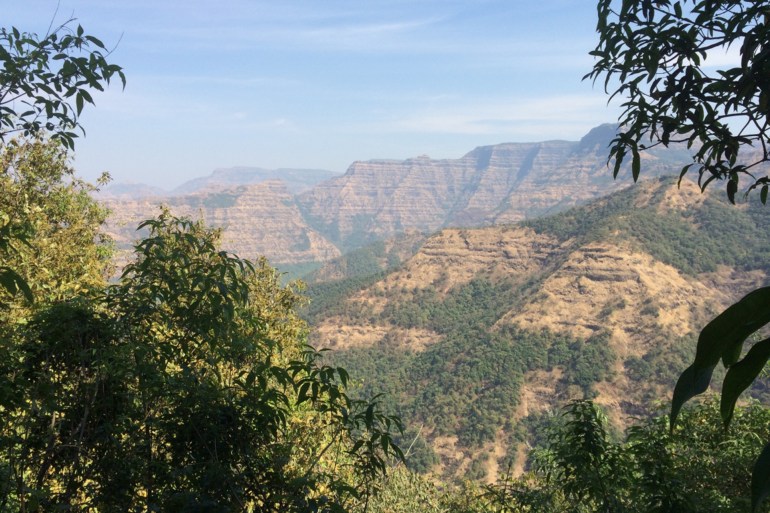 Layered lava flows dating from 66 million years ago in what geologists refer to as the Wai Subgroup, located near Ambenali Ghat in the Western Ghats of India. (Photo by Courtney Sprain)