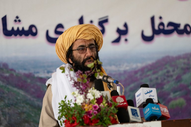 This photograph taken on April 17, 2024 shows poet Mohammad Alim Bismal reciting poetry at the Purple Flower Poetry Festival in Tap-e-Gul Ghundi recreational park of Charikar district, Parwan Province. As the Taliban government nears the end of its third year in power, it is working to impose its vision for the nation of more than 40 million people. Poetry is one of the only art forms that Kabul's rulers are allowing to flourish -- as long as the verses adhere to the government line. (Photo by Wakil KOHSAR / AFP) / TO GO WITH AFGHANISTAN-CULTURE-POETRY BY ABDULLAH HASRAT, JOE STENSON AND ZAHRAH NABI