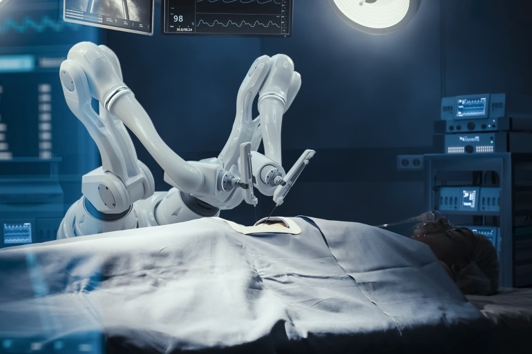 Surgery Patient Laying On Surgical Table While Robot Arms Performing High-Precision Nanosurgery In Hospital. Automated Robotic Limbs Operating, VFX Holographic Displays Showing Puls, Blood Pressure شترستوك