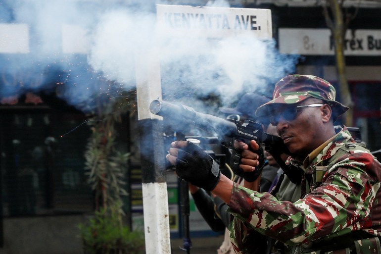 A police officer fires teargas during an anti-government demonstration over what organisers say are tax hikes, bad governance, constitutional violations, extra-judicial killings and cost of living, in Nairobi, Kenya, August 8, 2024. REUTERS/Monicah Mwangi