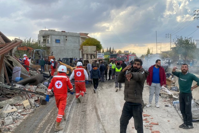 Rescuers from the Lebanese Red Cross search for victims and survivors at the site of an Israeli airstrike that targeted the village of Rasm El-Hadath in the eastern Lebanese Bekaa valley on November 10, 2024, amid the ongoing war between Israel and Hezbollah. (Photo by Sam SKAINEH / AFP)