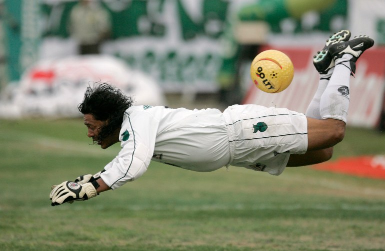 Former Colombian goalkeeper Rene Higuita dives to save the ball during his farewell match at the Atanasio Girardot Stadium in Medellin Former Colombian goalkeeper Rene Higuita dives to save the ball during his farewell match at the Atanasio Girardot Stadium in Medellin January 24, 2010. REUTERS/Albeiro Lopera (COLOMBIA - Tags: SPORT SOCCER)