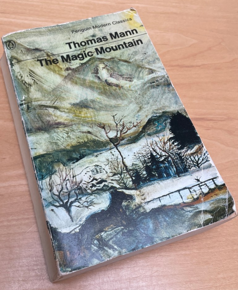 Wiltshire, UK - 9th July 2023: A well read copy of The Magic Mountain. A paperback story book by Thomas Mann. A Penguin Classic