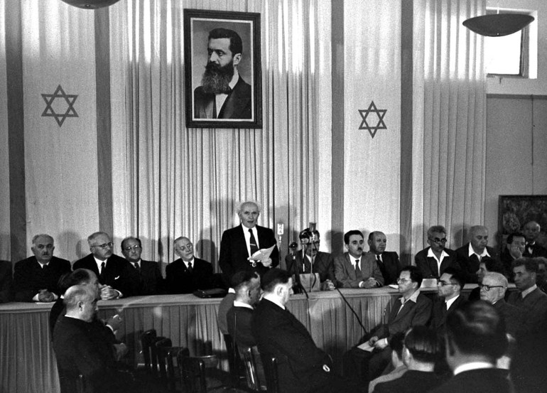 MAY 1948 FILE PHOTO - David Ben Gurion (C), Israel's first prime minister, declares May 15, 1948 independence for the State of Israel, made possible by the United Nations vote on November 29, 1947 to partition Palestine. The Jewish state begins this coming week a year of celebration marking its 50th anniversary.