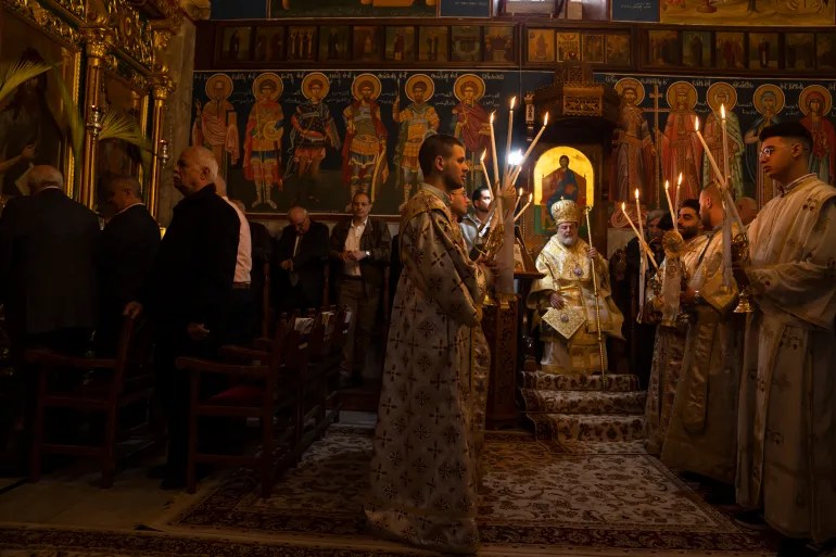 Palestinian Christians attend Palm Sunday mass in a Greek Orthodox church in Gaza City on Sunday, April 9, 2023 – before Israel’s war on Gaza began [Fatima Shbair/AP]