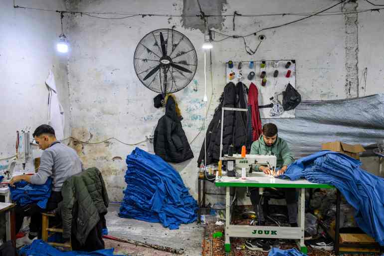 Syrian refugees work in a Syrian owned clothing factory in Gaziantep, on December 10, 2024. Islamist-led rebels declared on December 8, 2024, that they have taken the Syrian capital in a lightning offensive, sending President Bashar al-Assad fleeing and ending five decades of Baath rule in Syria. (Photo by Yasin AKGUL / AFP)