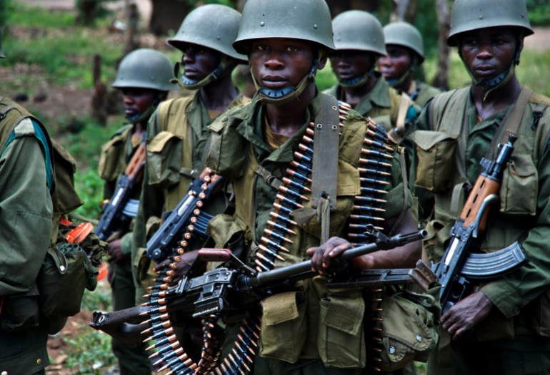 Congolese soldiers patrol the town of Rutshuru in eastern Congo, January 28, 2009. Plans to integrate Tutsi rebels into Congo's army faltered before they could begin on Wednesday, underlining the challenges facing efforts to pacify the east despite renewed Congo-Rwanda cooperation. Separately,Ugandan Lord's Resistance Army rebels killed more than 100 people in a village in Congo in an apparent reprisal for army operations against them, the United Nations said on Tuesday.REUTERS/Alissa Everett (DEMOCRATIC REPUBLIC OF CONGO)