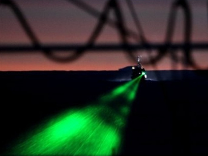 In this photo released by the Institute of Cetacean Research of Japan, anti-whaling group Sea Shepherd's ship the Bob Barker fires a laser beam at the Japanese whaling ship Nisshin Maru in the waters of Antarctica Saturday, Feb. 6, 2010. The Bob Barker and Japanese harpoon boat the Yushin Maru 3 collided in the waters off Antarctica on Saturday - the second major clash this year in the increasingly aggressive confrontations between the two sides.