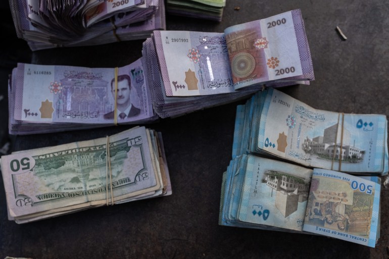 ALEPPO, SYRIA - DECEMBER 15: The image of Syria's former President Bashar al-Assad is seen on Syrian Dinar banknotes at a street exchange on December 15, 2024 in Aleppo, Syria. Aleppo was the first major city to fall in last week's lightning offensive by rebel forces as they toppled Syria's Assad regime. (Photo by Burak Kara/Getty Images)