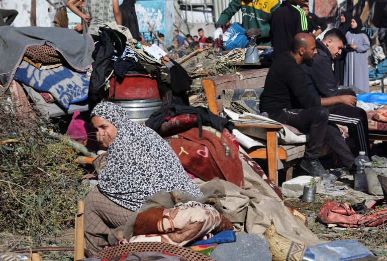 Palestinians inspect the site of an Israeli strike on an UNRWA school sheltering displaced people, in the Bureij camp in the central Gaza Strip, May 7, 2025. REUTERS/Ramadan Abed