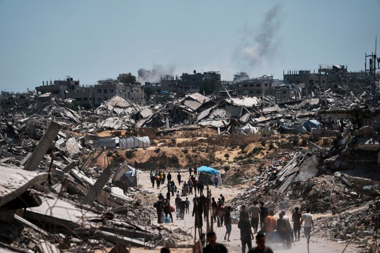 Displaced Palestinians return to retrieve their belongings from their homes in the area where the Israeli army operated in the northern Gaza Strip on Wednesday, June 4, 2025. (AP Photo/Jehad Alshrafi)