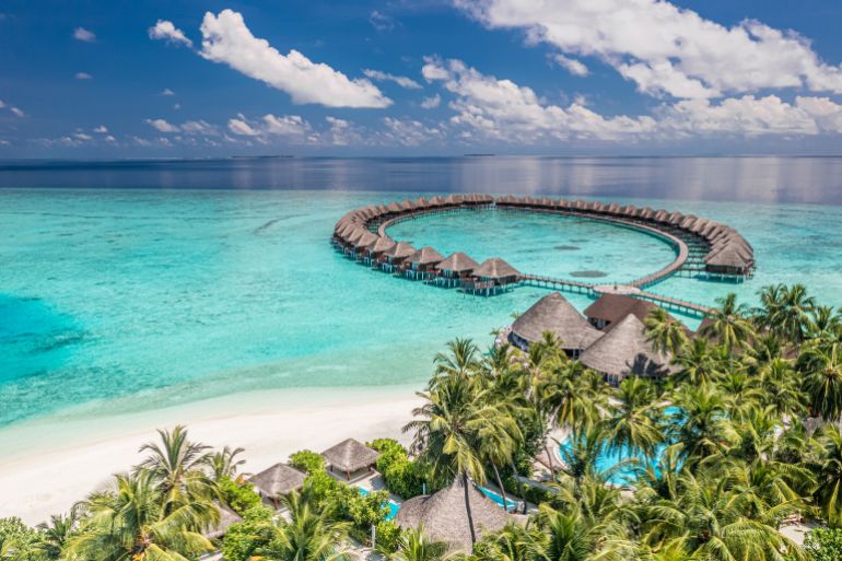 Perfect Maldives paradise scene. Tropical aerial landscape, seascape, luxury water villas. Amazing sea sky, reef lagoon beach picturesque nature. Exotic tourism, panoramic destination, summer vacation