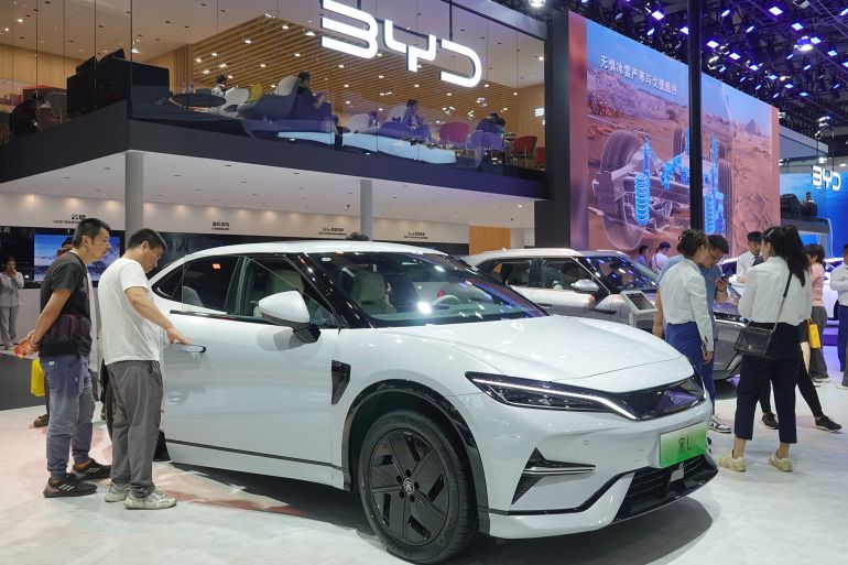 Spectators are looking at BYD Song L electric cars at the 21st Changchun International Automobile Expo in Changchun, Jilin province, China, on July 17, 2024. (Photo by Costfoto/NurPhoto via Getty Images)