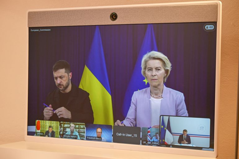 European Commission Ursula van der Leyen and Ukraine's President Volodymyr Zelenskyy appear on a screen during a video conference with French President Emmanuel Macron as part of the so-called "coalition of the willing", Sunday, Aug. 17, 2025 at the Fort de Bregancon in Bormes-les-Mimosas, southern France. (AP Photo/Philippe Magoni, Pool)