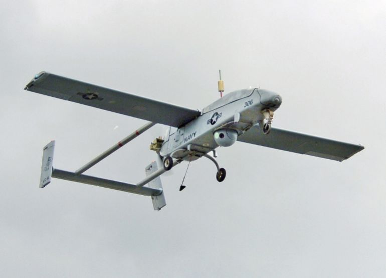 U.S. Navy RQ-2B Pioneer Unmanned Aerial Vehicle, assigned to the ?Firebees? of Fleet Composite Squadron Six (VC-6), uses its sensor turret to scan the crowd as it conducts a pass during its flight demonstration at the 2005 Naval UAV Air Demo held at the Webster Field Annex of Naval Air Station Patuxent River. The Pioneer Unmanned Aerial Vehicle (UAV) system provides real-time intelligence and reconnaissance capability to the field commander. This highly mobile system provides high quality video imagery for artillery or naval gunfire adjustment, battle damage assessment, and reconnaissance over land or sea. VC-6 is the Navy's sole operator of the Pioneer. The daylong UAV demonstration highlights unmanned technology and capabilities from the military and industry and offers a unique opportunity to display and demonstrate full-scale systems and hardware. This year's theme was, "Focusing Unmanned Technology on the Global War on Terror". U.S. Navy photo by Photographer?s Mate 2nd Class Daniel J. McLain (RELEASED)